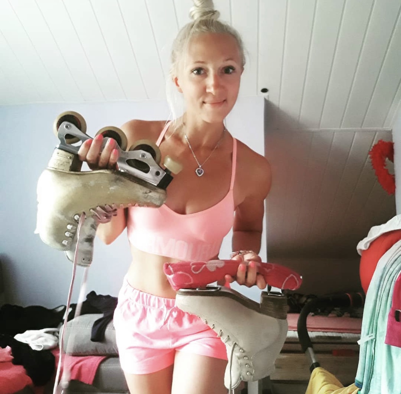 Natalia holding ice and inline figure skates