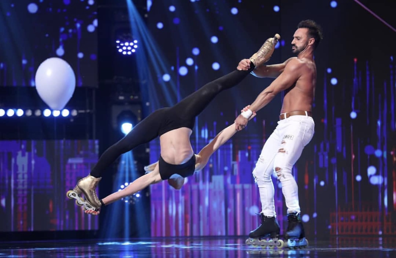 Natalia performing an inline skating pair element on television